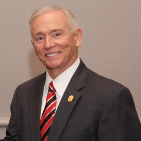 man wearing a red striped tie