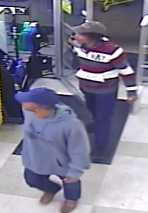 two men entering a store