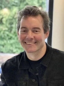 David Westbrook smiling at camera